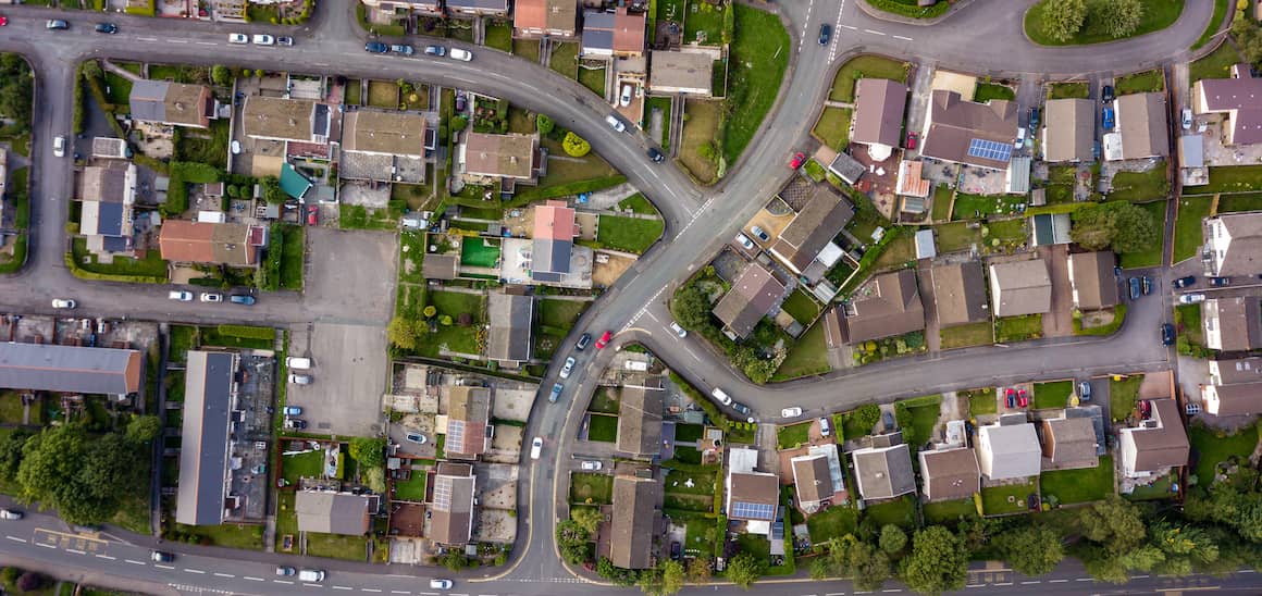 RHB Assets From IGX: Aerial view of a suburban neighborhood with green lawns