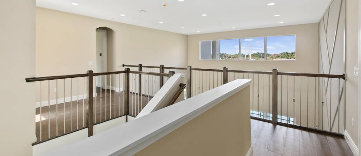 RHB Assets From IGX: Second-story landing in a modern home with a staircase