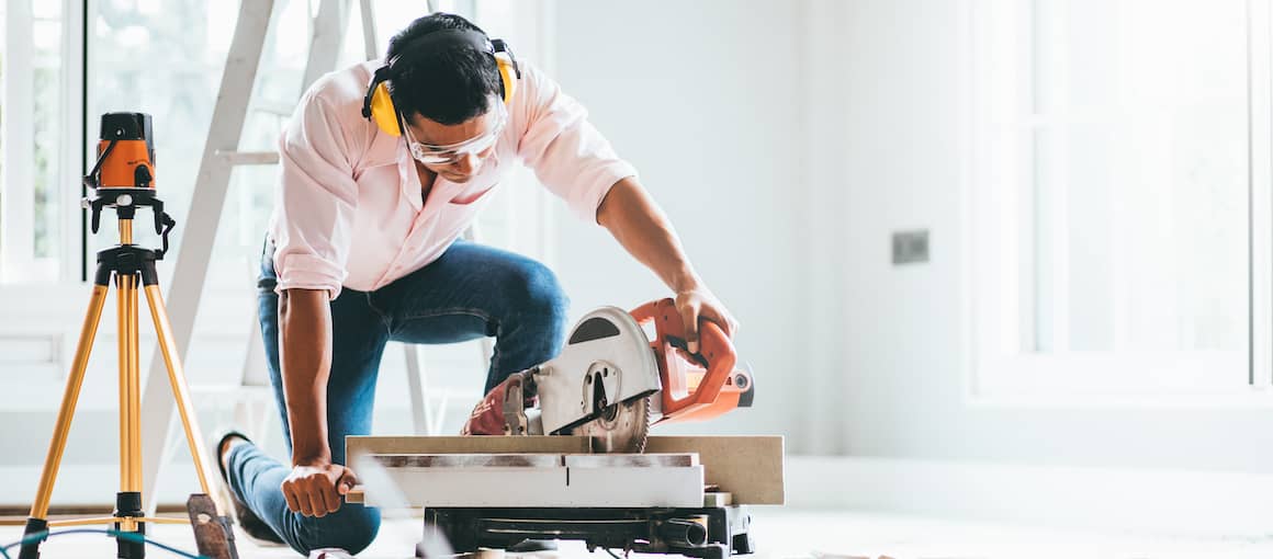 A man at home doing home improvement.