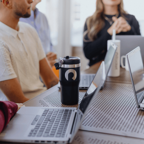 Team members around a conference table.