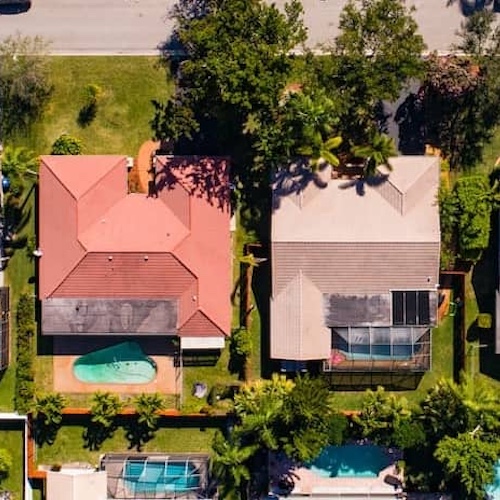 Houses lined up, showing different architectural styles or options for residential properties.
