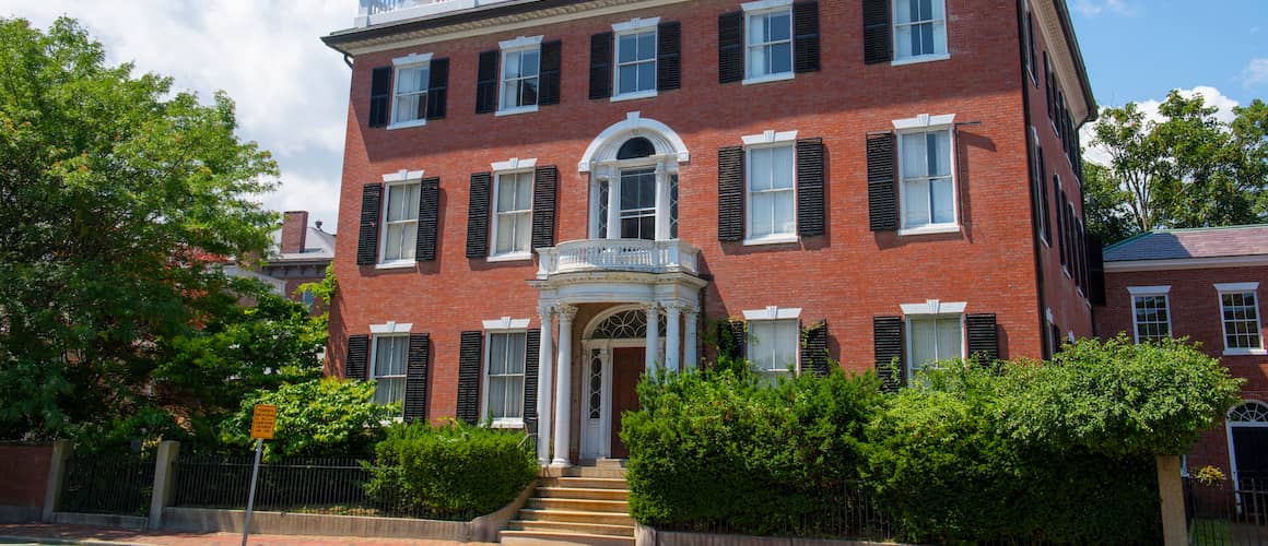 A Federal-style brick building, potentially representing historic architecture.