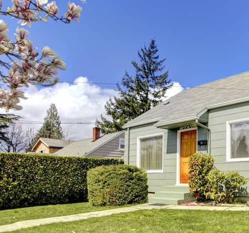 A small greenhouse or conservatory, showcasing a structure designed for gardening, relaxation, or cultivating plants within a home setting.