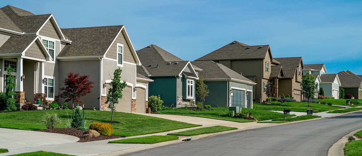 RHB Assets From IGX: Sunny neighborhood street with trees and houses