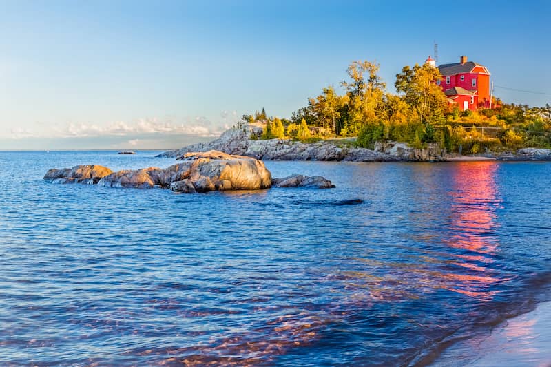 RHB Assets From IGX: Serene lake house nestled among trees in Marquette, Michigan