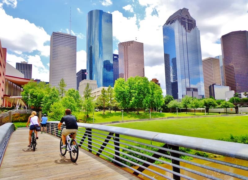 RHB Assets From IGX: Bicycle path in downtown Houston, Texas with a cityscape backdrop.