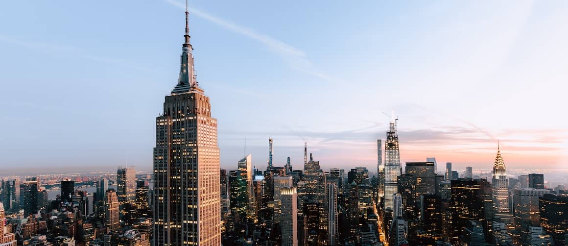 RHB Assets From IGX: The iconic Empire State Building amidst other skyscrapers in New York City.