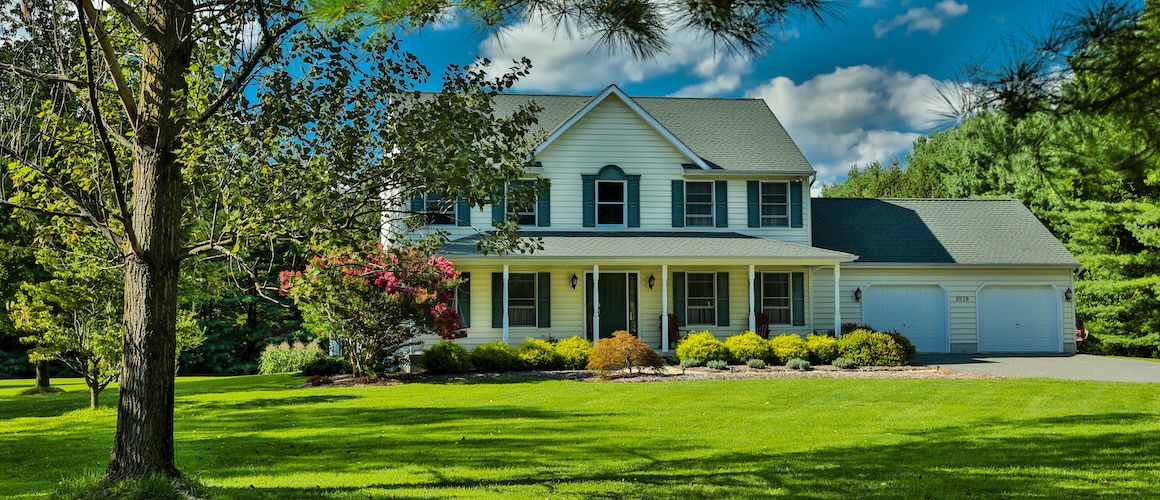 RHB Assets From IGX: Single-family home with a beautiful front yard and blue sky