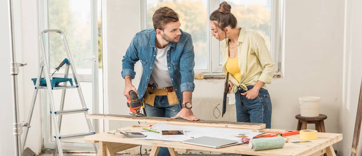 Stock-Young-Couple-Cutting-Wood-For-Renovations-AdobeStock232259957 copy.jpg