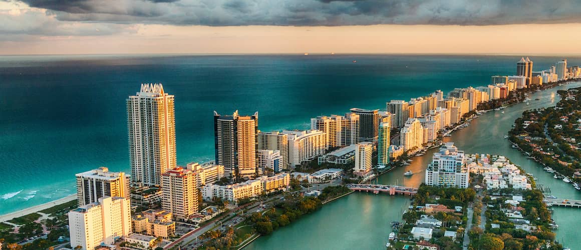 Miami Beach skyline, featuring buildings and the coastline.