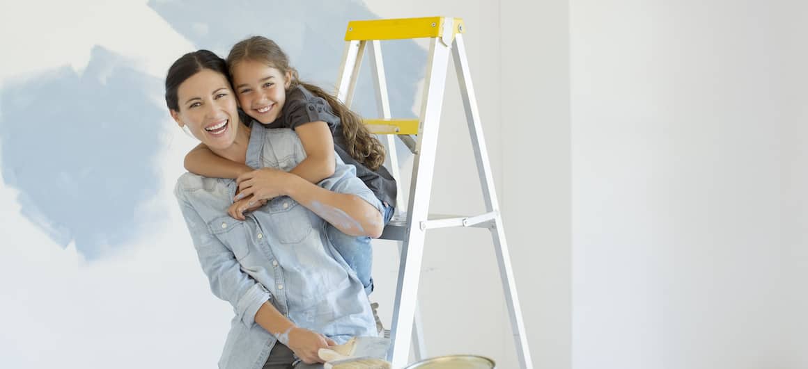 Mom and daughter fixing up home, showcasing a mother and daughter engaged in home improvement.