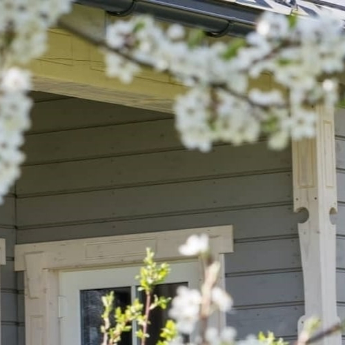 An image showing grey and off-white house possibly a good real estate investment.