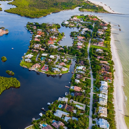 Overhead view of Naples, Florida with homes along waterways.