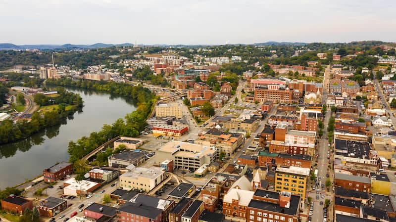 RHB Assets From IGX: A stunning riverfront view of downtown Morgantown, West Virginia, showcasing its city center.