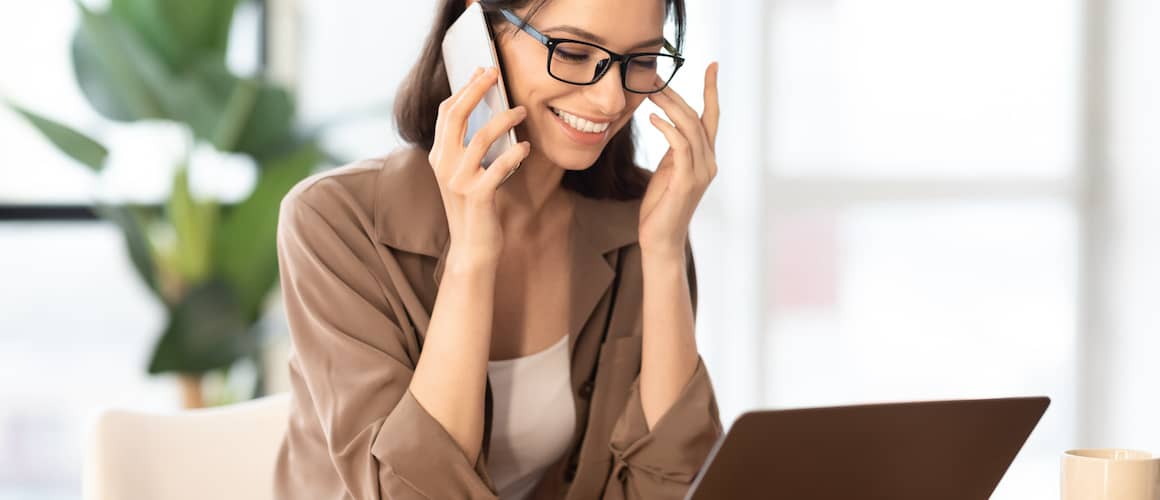 Woman reading email from real estate agent.