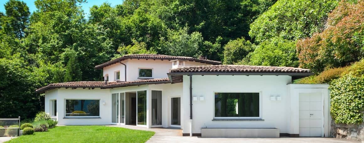 A white house exterior, illustrating a residential property with a classic design.