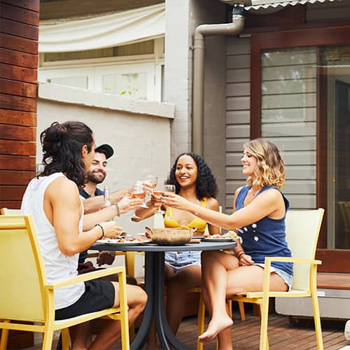 RHB Assets From IGX: Group of diverse millennials sitting and discussing home-buying trends in a modern living space.