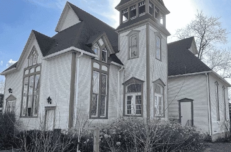 Grey and white historic church.