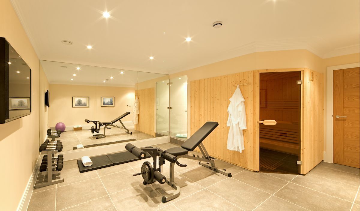 RHB Assets From IGX: A well-equipped home gym with various exercise equipment.