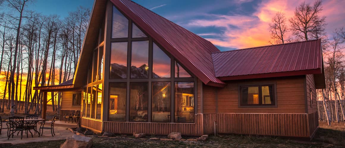 An A-frame house in Colorado at sunrise.