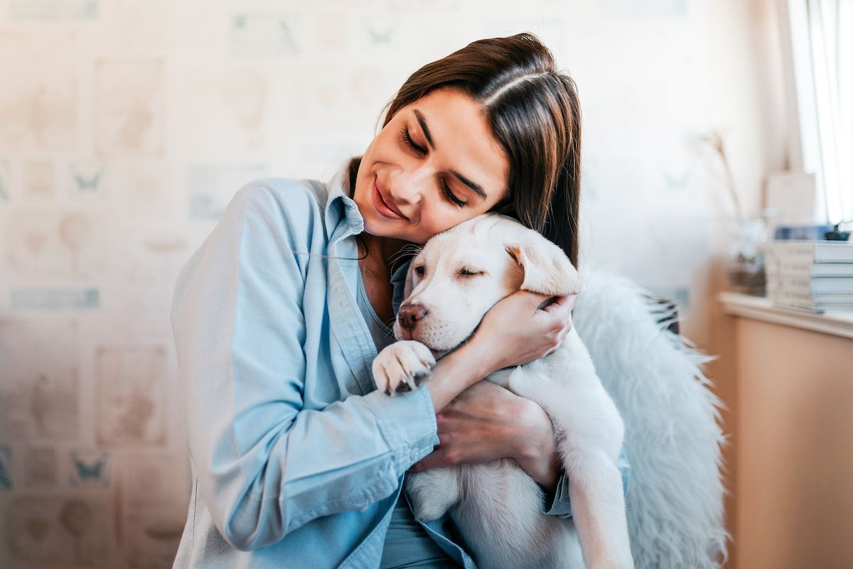 RHB Assets From IGX: Woman holding a puppy