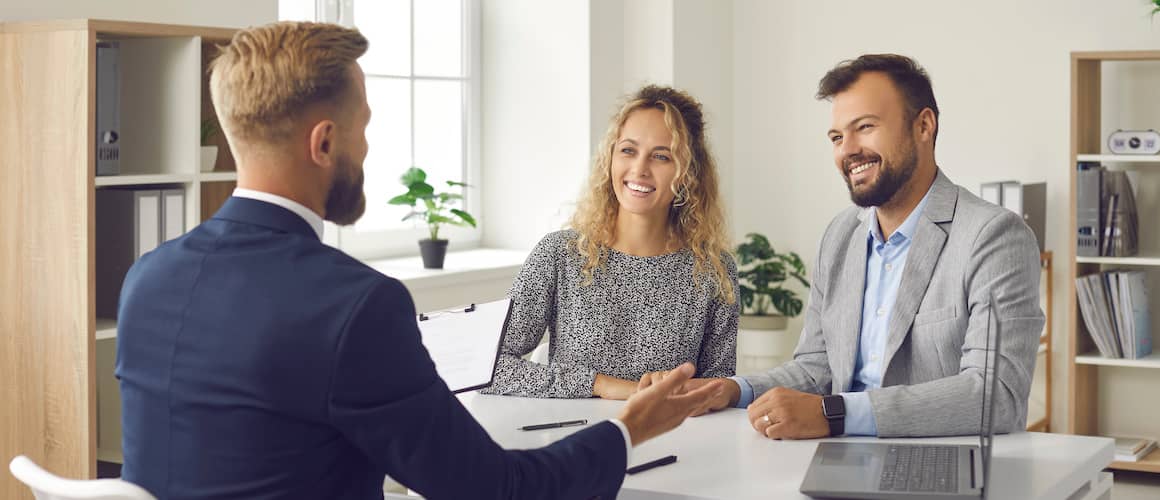 RHB Assets From IGX: Manager discussing with clients in a modern office