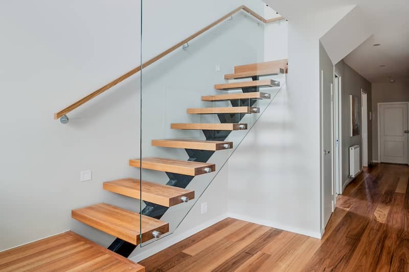 Contemporary flooring and staircase with glass sides.